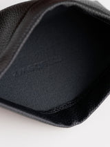 Kleine schwarze Kosmetiktasche mit Magnetverschluss