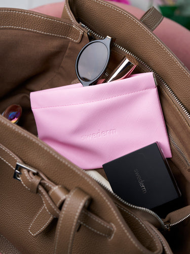 Kleine rosa Kosmetiktasche mit Magnetverschluss